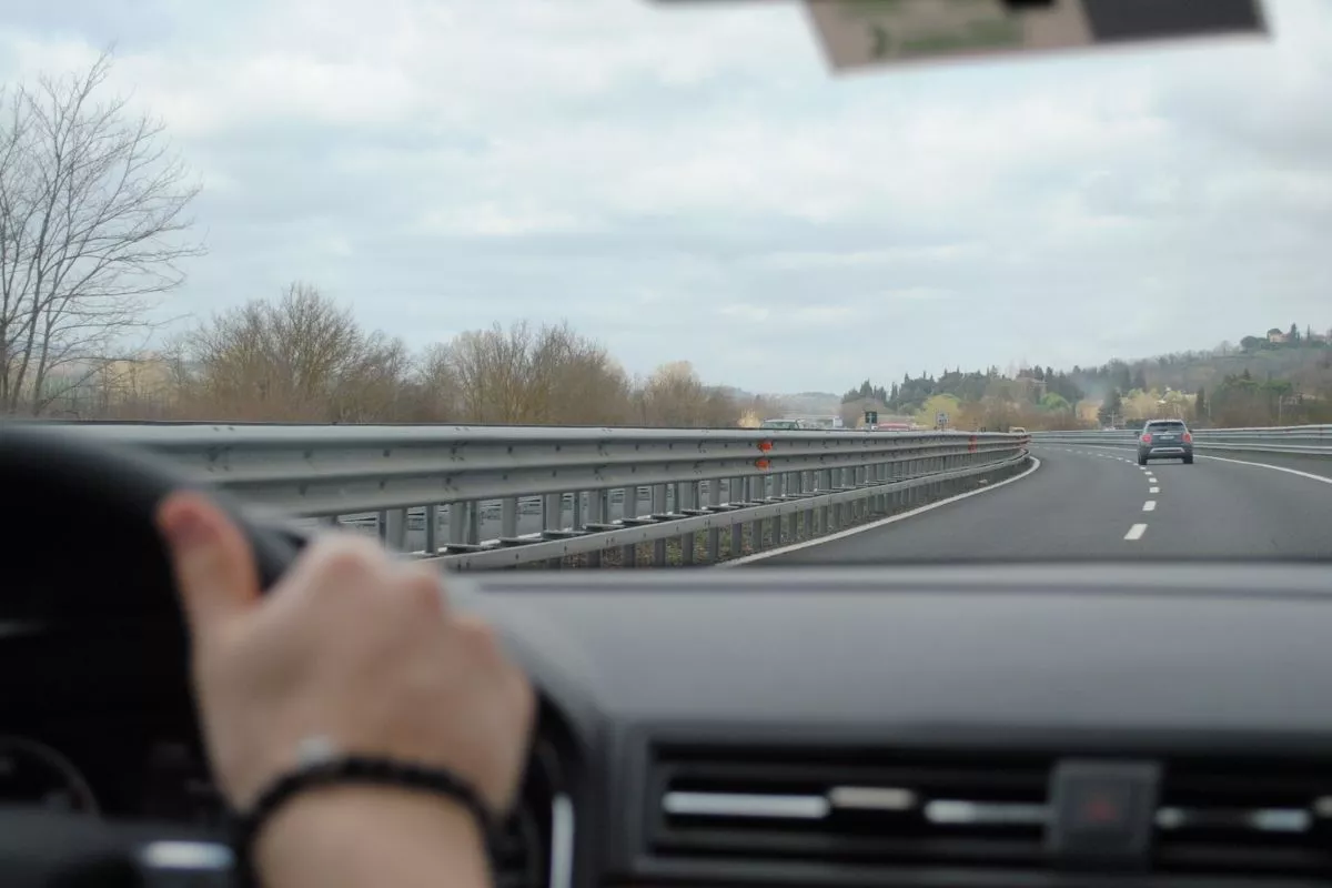 A man driving down a highway