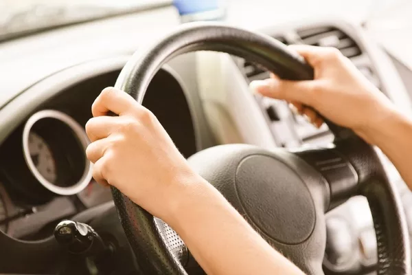 hands on the steering wheel