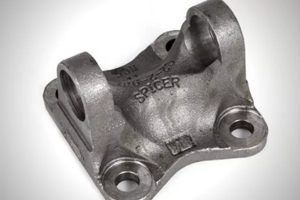 The driveshaft flange that holds the u-joint in place A picture of a driveshaft flange