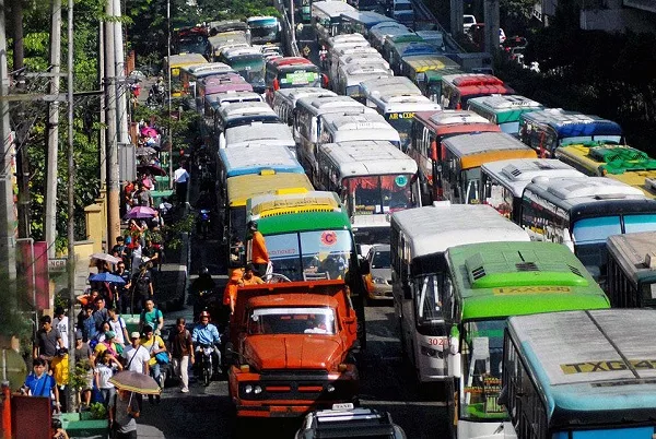 A picture of a road full of buses manila 