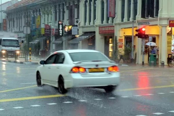 The red light means stop, but some drivers chose to ignore it Car beating the red light