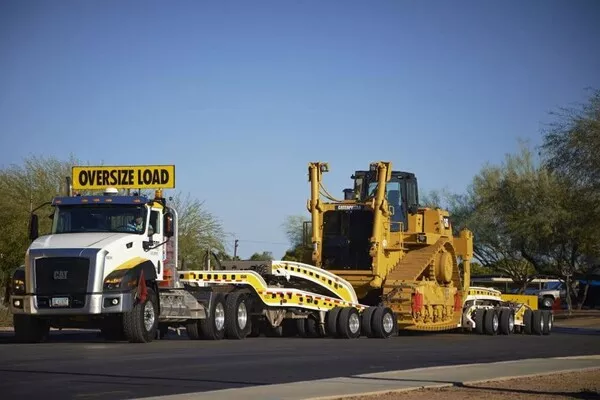 driving behind heavy equipment