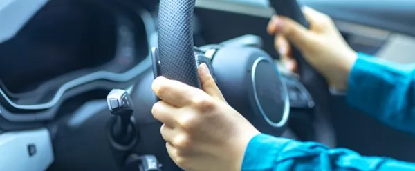 hands on steering wheel