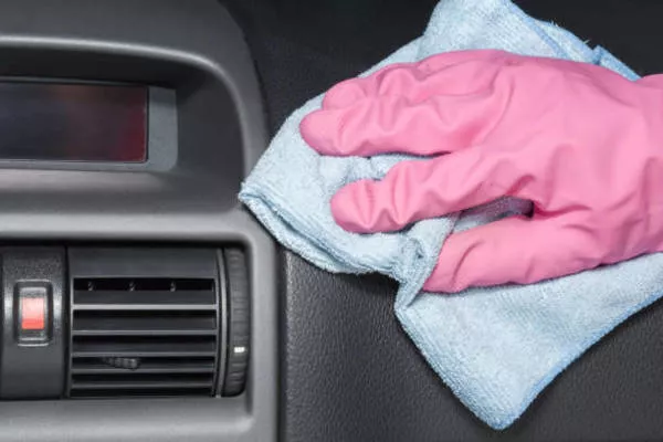 Man wiping the dashboard