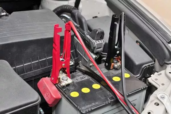 car battery with jumper cables