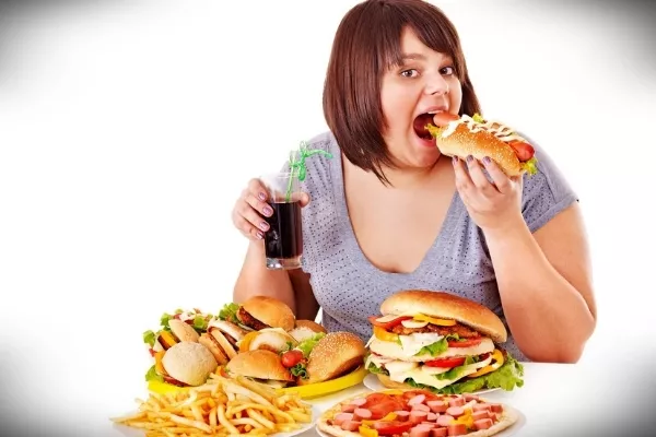 Can make you drowsy when driving, on a full stomach! a girl is eating