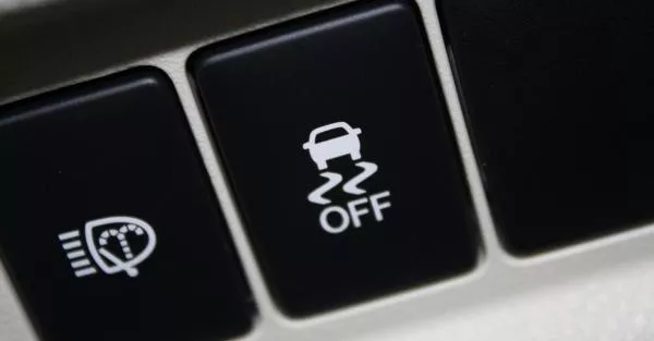 Electronic Traction Control limits wheel slip and prevents the vehicle from spinning as it traverses wet and slippery road conditions Electronic Traction Control button