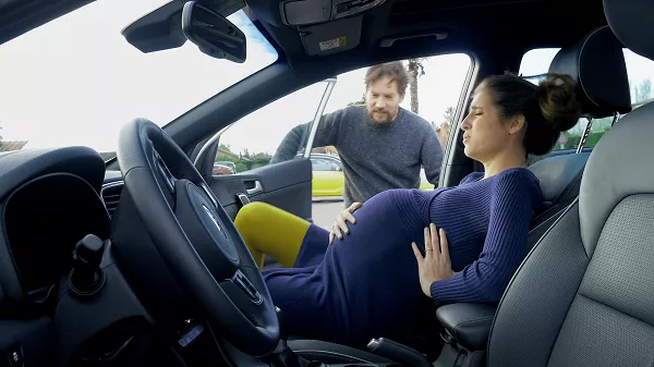 If your wife would need your comfort through the painful labor, it is better to call an ambulance Pregnant woman in labor