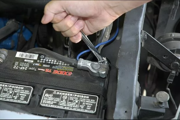 Man disconnecting the battery 