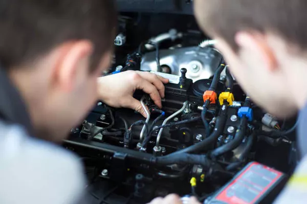 Men inspecting the engine