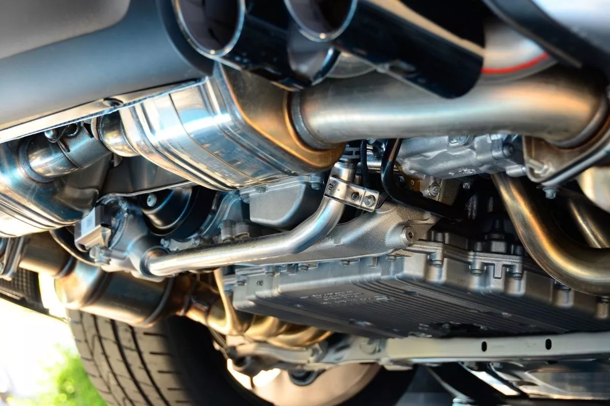 The exhaust pipes are carefully bent to fill the spaces underneath a car Car components from below