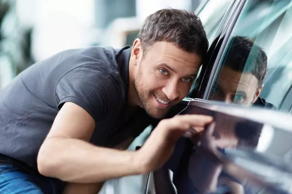 Man checking the car exterior 