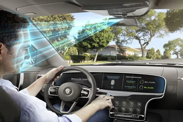 Man driving a car with biometric technology