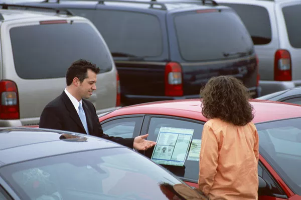 Photo of a worried car salesman