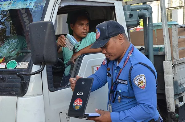 Traffic enforcer Philippines apprehending a driver