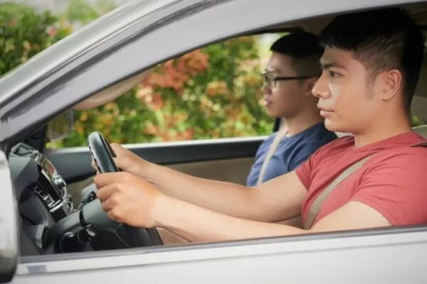 You can try and have a friend or a loved one with you while driving. Man driving