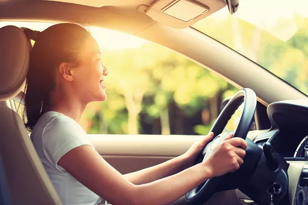 It would be best to limit your driving to familiar routes and only during the day, in good weather and always with a companion. Woman driving confidently
