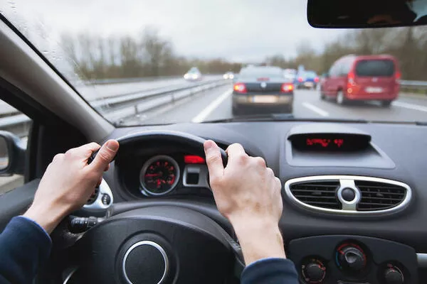 man holding the steering wheel