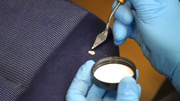 Fixing car seat with cigarette burn