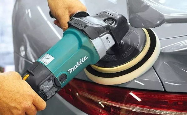 man buffing the car's paint