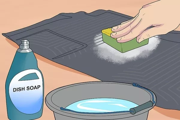 using brush to clean floor mats