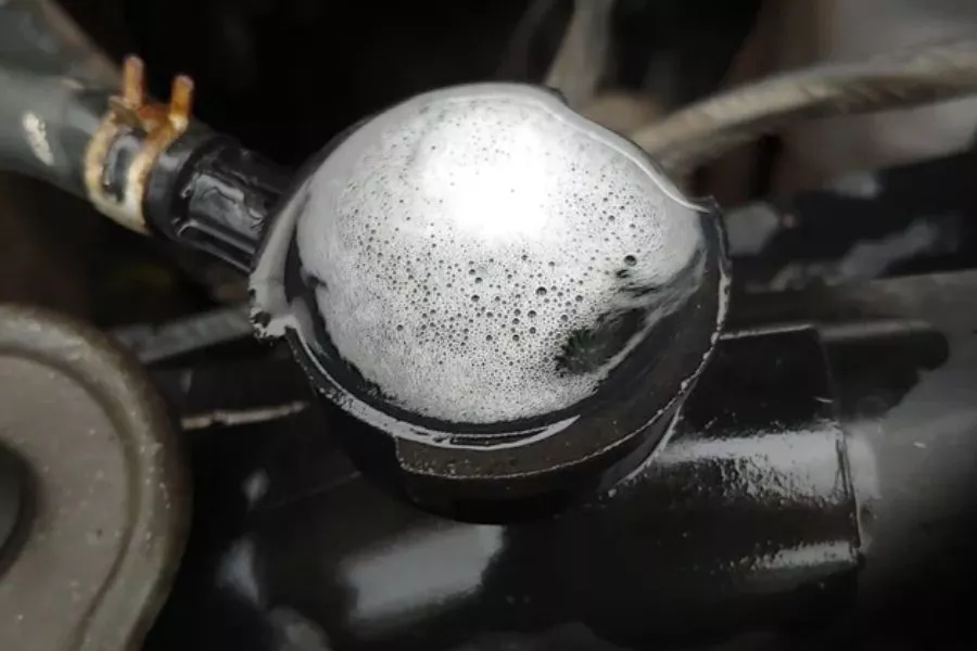 A picture of coolant bubbling out of coolant reservoir