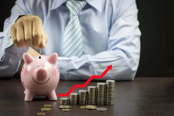 Man with coins and piggy bank
