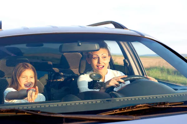 A lady and a kid inside the car