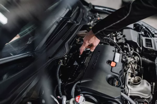 man checking the engine