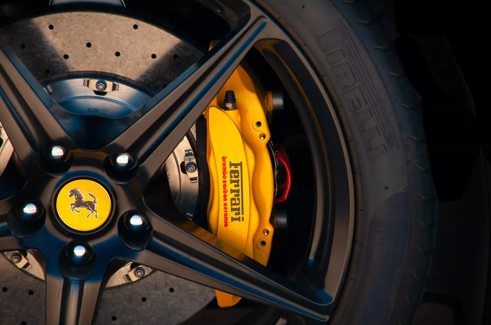 Yellow Ferrari brake caliper