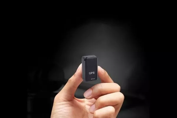 A mini GPS held by hand