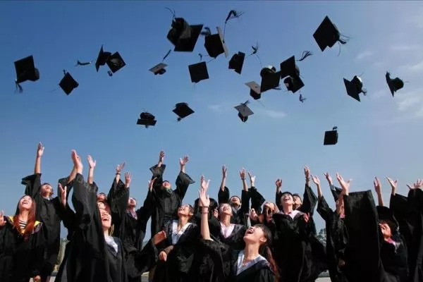 A picture of college graduates mid-celebration