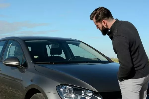 Also, don't be shy to talk to your car. If no one's in earshot distance that is A picture of a man looking at his car
