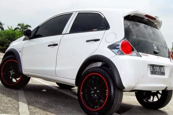 A white brio with big wheels