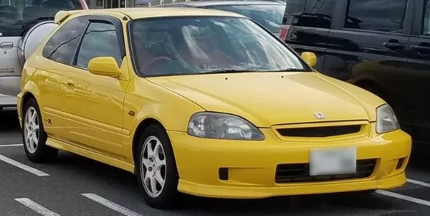 A picture of a yellow Honda Civic Type R Ek9