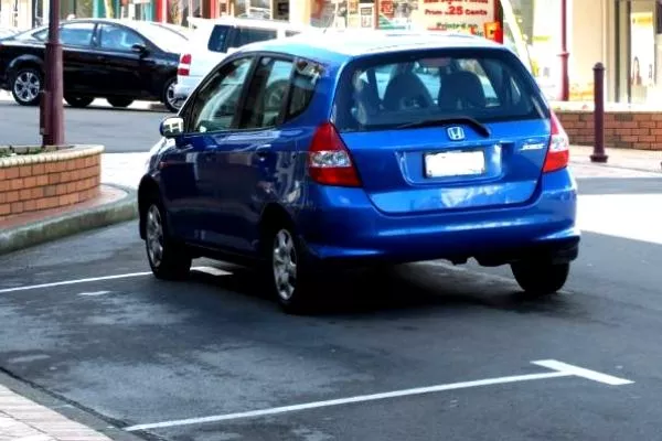 Blue Honda Jazz Parked like a jerk