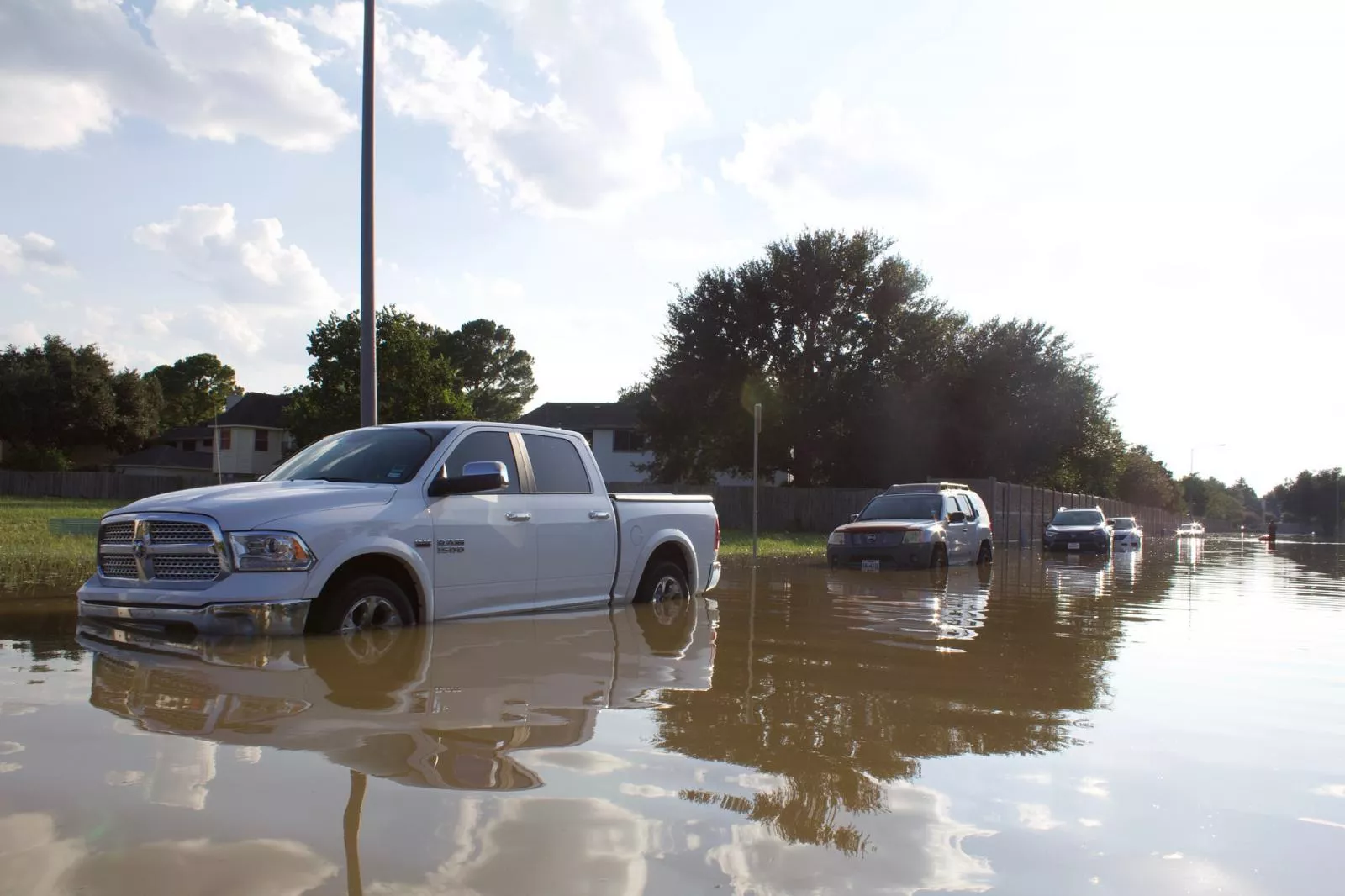 A pickup truck driving through flood