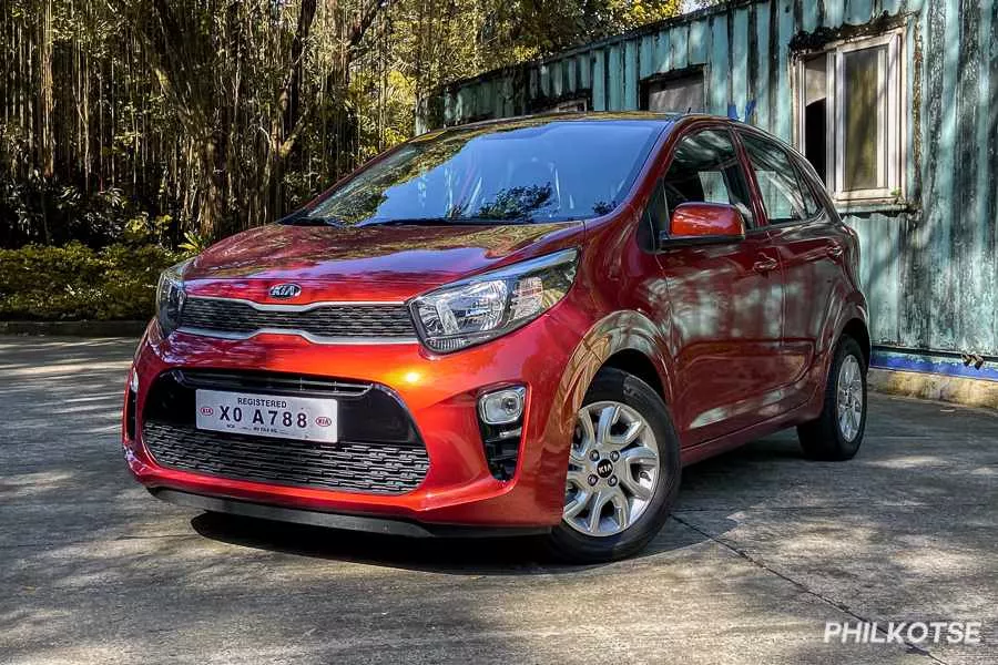Another picture of the Kia Picanto while it is parked under trees