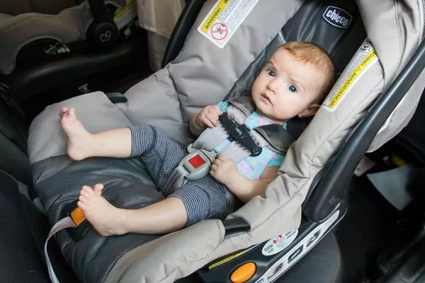 an infant in the car seat