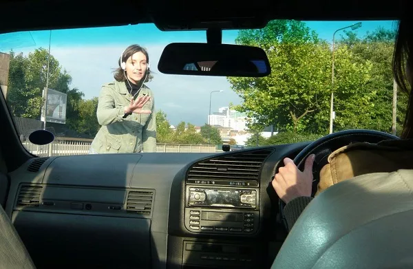 Some people dare to throw themselves into a running vehicle and even ask for financial compensation for the injuries that person sustained Running lady towards the car