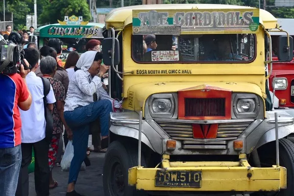 Jeepney and passengers