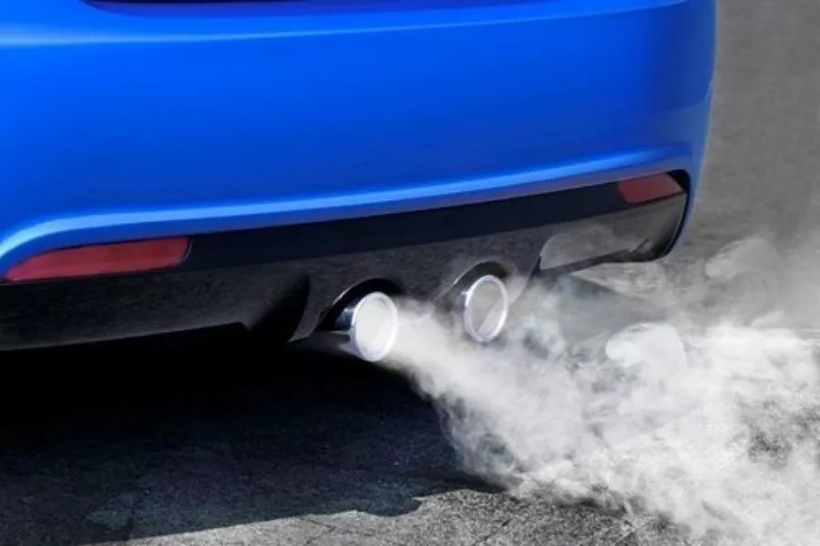 White smoke from a blue car