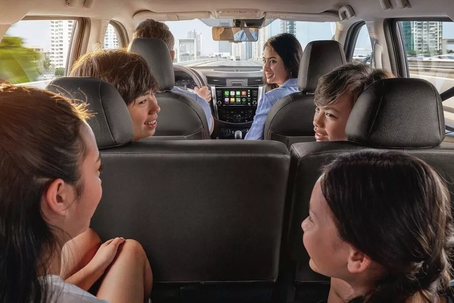 A picture of a family riding a seven-seater midsize SUV