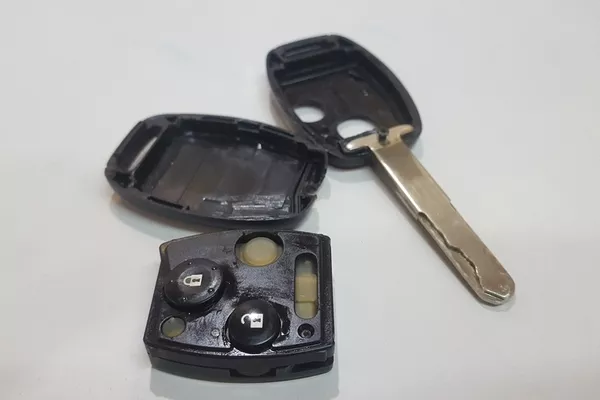 If the battery terminals look fine, you can take a look at where the buttons are placed opened car key fob