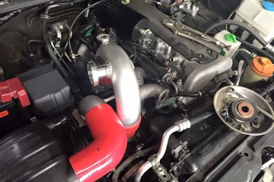 A picture of the Speelab Jimny supercharger being installed