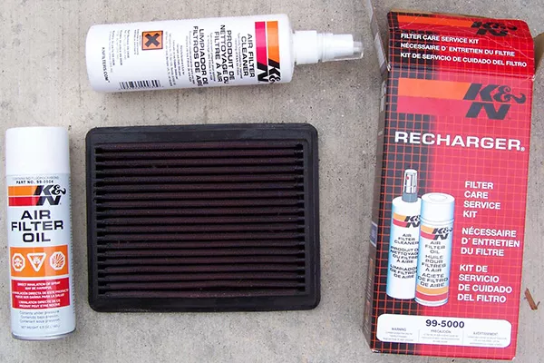 A K&N air filter and cleaning kid laid out for display