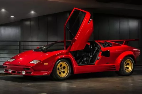 Awww. It looks like the Countach is waving at you A Lamborghini Countach with it's driver's side door open