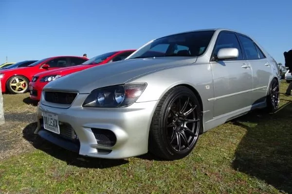 A picture of a Lexus IS200 in a car meet