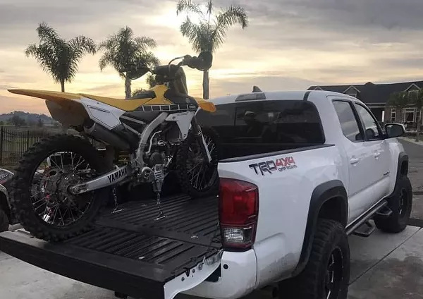 Load motorbike on truck bed