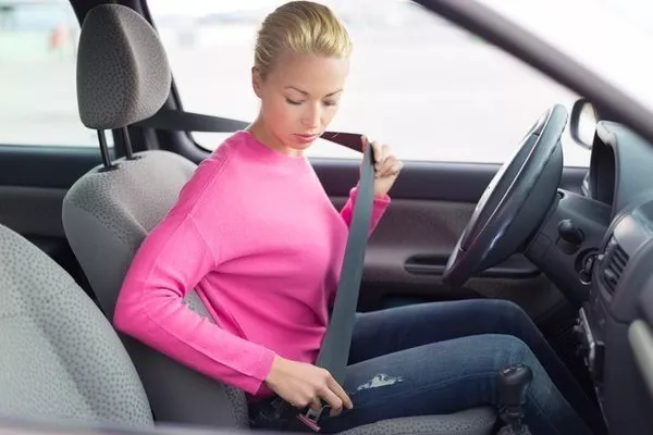One major cause of feeling sleepy and exhausted is slouching and sitting in an uncomfortable position Woman wearing seat belts
